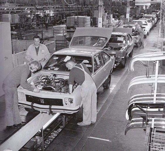 A black and white photo of the Holden Torana A9X production line